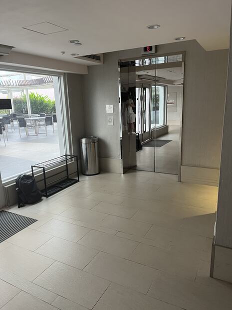 Lift and glass wall